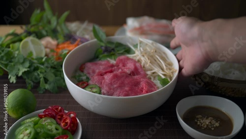 authentic vietnamese pho rice noodle with raw beef