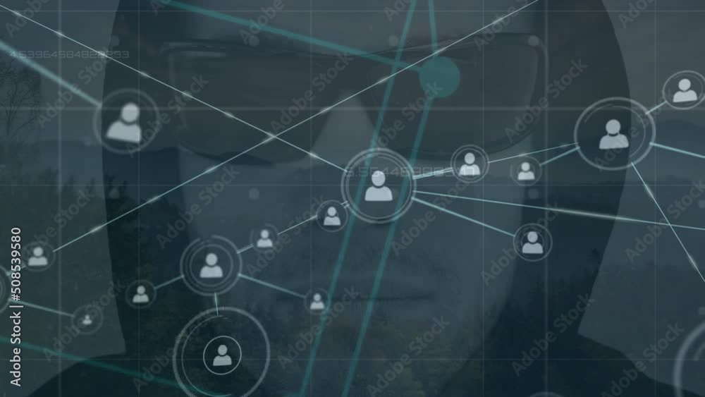 Animation of network of connections with icons over caucasian male hacker Animation of network of connections with icons over caucasian male hacker