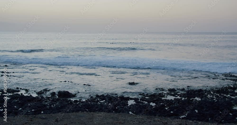 Clear azure Atlantic Ocean on background rocky volcanic shore, sunset. Perfect place for travel and rest. Never-ending beauty of nature. Clear azure Atlantic Ocean on background rocky volcanic shore, sunset. Perfect place for travel and rest. Never-ending beauty of nature.