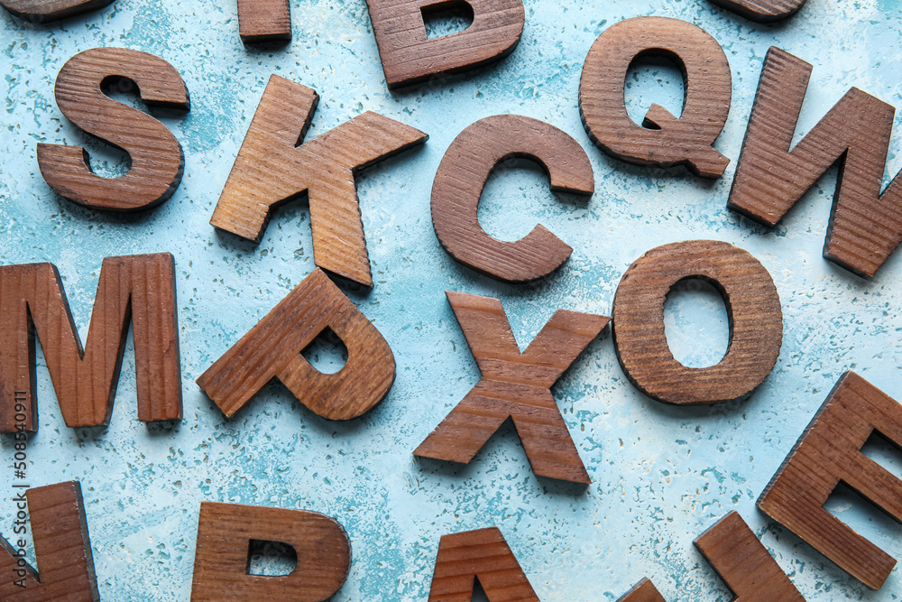 Wooden letters on grunge background. Alphabet concept