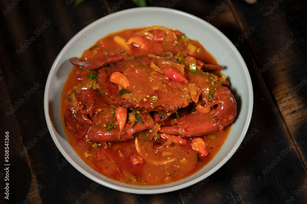 Crab in Padang sauce or Padang crab is an Indonesian seafood dish of crab served in hot and spicy Padang sauce. Crab in Padang sauce or Padang crab is an Indonesian seafood dish of crab served in hot and spicy Padang sauce.