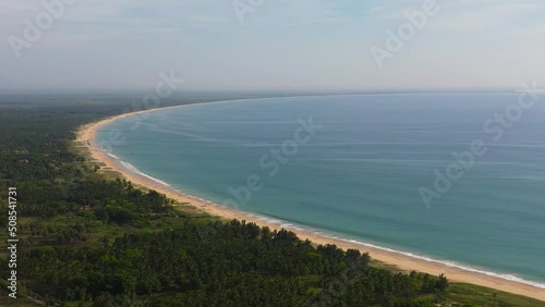 Aerial view of Tropical sandy beach and blue sea. Kalkudah Beach, Sri Lanka. photo