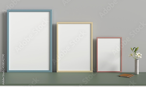 three pictures frames on table for mockup, 3d rendering 