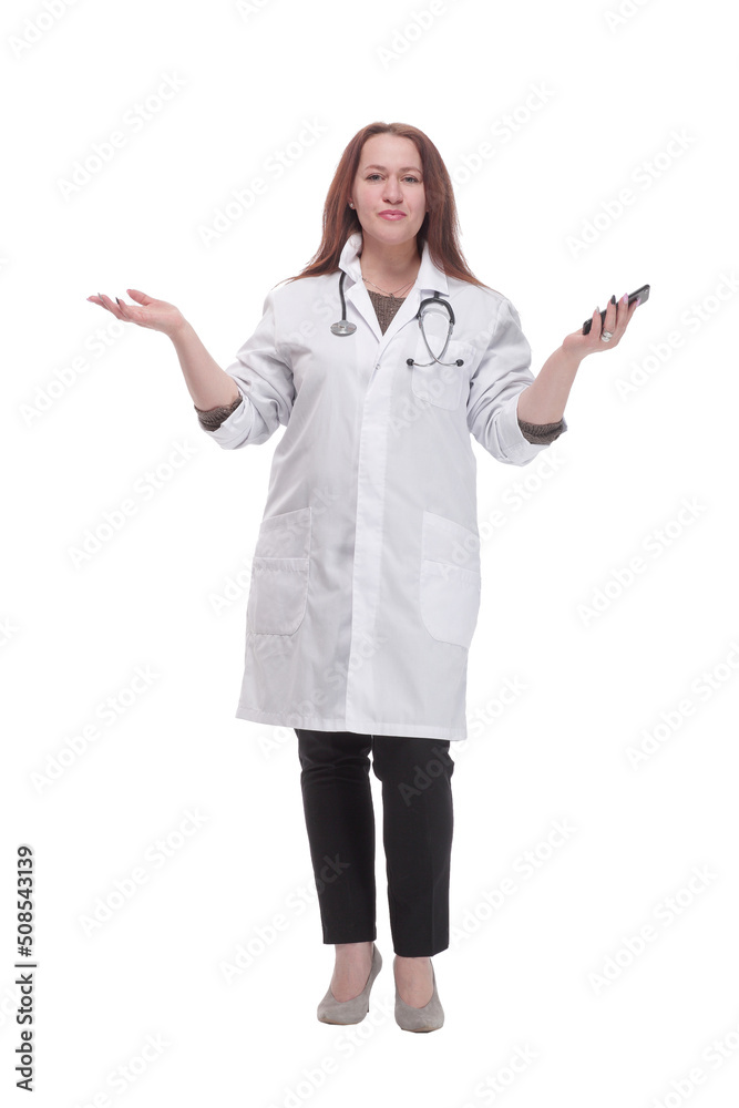 in full growth. qualified female doctor with a smartphone. in full growth. qualified female doctor with a smartphone.