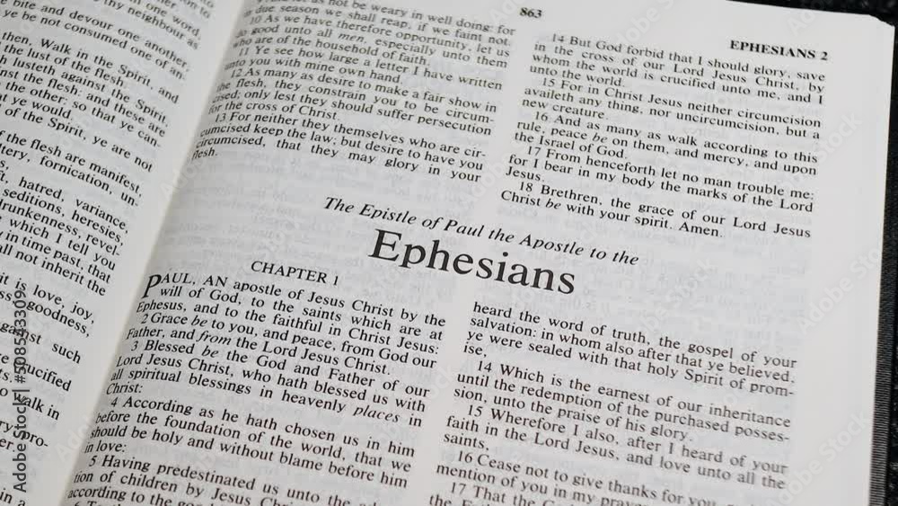 Close Up Shot of Bible Page Turning to the book of Ephesians Close Up Shot of Bible Page Turning to the book of Ephesians