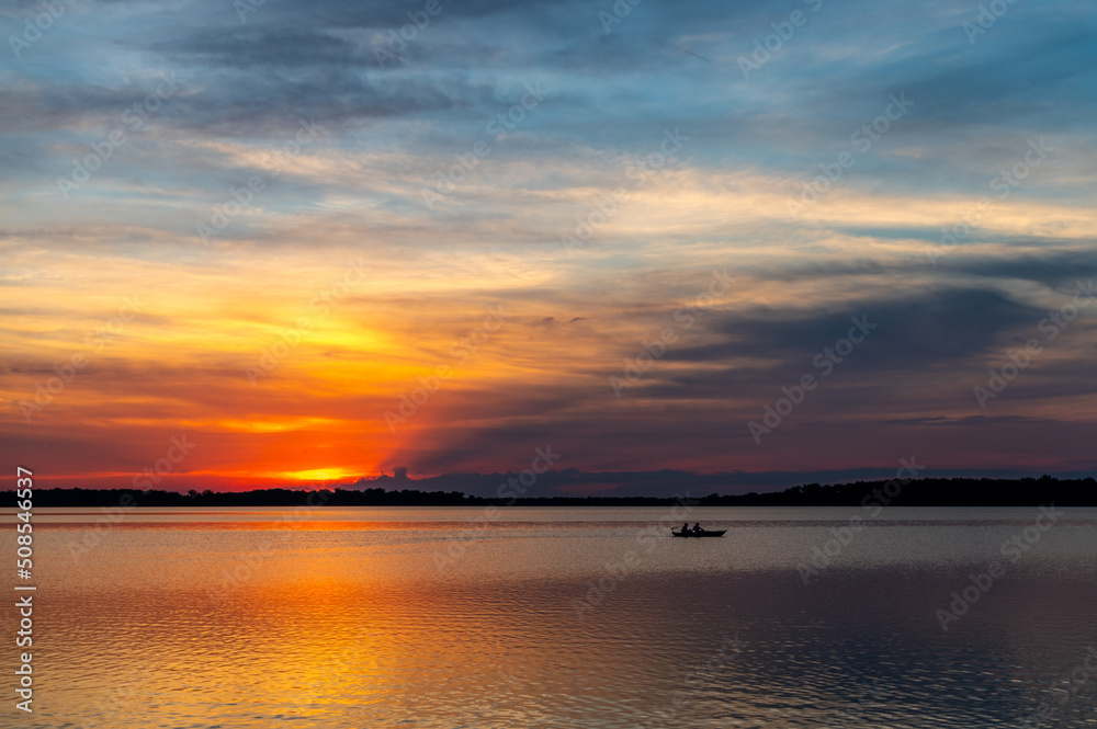 Fishing Boat at Sunset with Colorful Sky Fishing Boat at Sunset with Colorful Sky