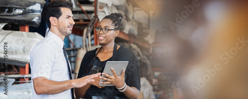 Business man and woman discuss and looking at tablet, brainstorming nd cooperate concept