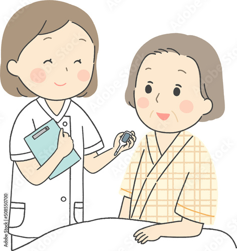 入院患者の検温をする看護師