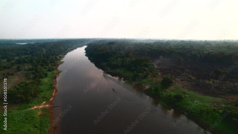 The boat sails on the river which is in jungle. The boat sails on the river which is in jungle.