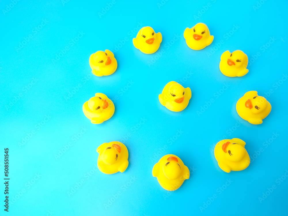 Group of toy ducks with leadder. Leadder and teamwork concept