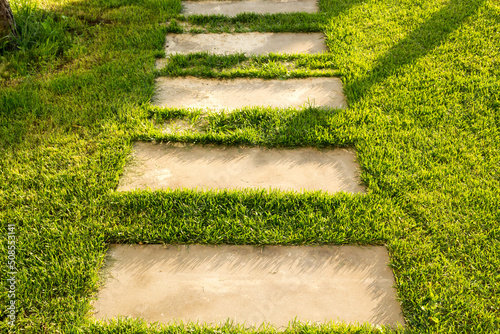 concrete path lawn pedal rectangular shape in regular grid routed directly through beautiful lawn suns and shadows stone , concrete large slabs, slab, rectangle, railroad tie