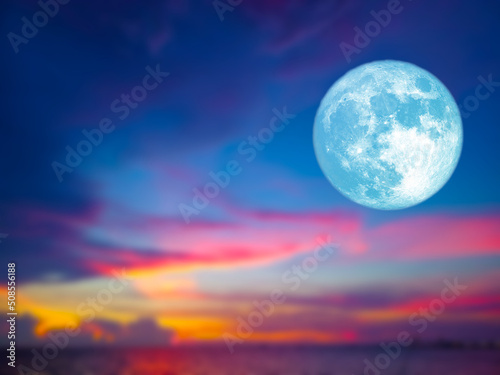 blue moon and blur sunset sky colorful on the ocean