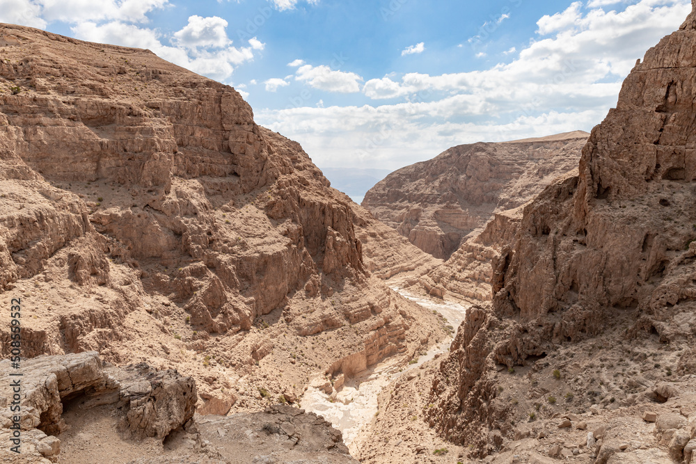 Dry  river bed passing through the stone desert near the Khatsatson stream, on the Israeli side of the Dead Sea, near Jerusalem in Israel