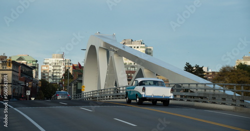 Classic white and blue car on Johnson bridge photo
