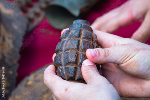 F1 Hand grenade (explosive) old in the hands of a child.