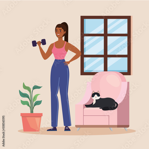 woman lifting dumbbell with cat
