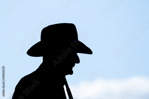 Silhouette of stockman in hat. photo