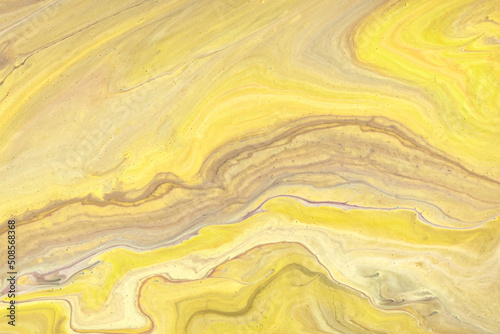 Abstract fluid art background light yellow and beige colors. Liquid marble. Acrylic painting with gradient and splash. © nikol85