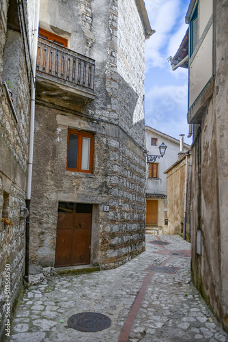 A narrow street between the old houses of Petina, a village in the mountains of Salerno province, Italy.