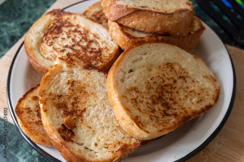 fried slices of wheat bread on a plate