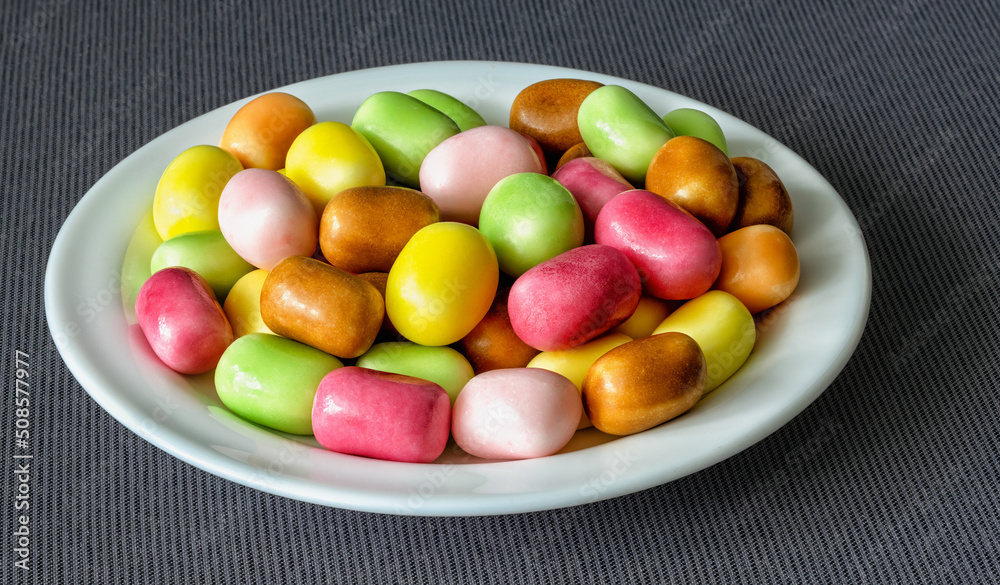 a bunch of chewing candies with a sparkling filling on a plate a bunch of chewing candies with a sparkling filling on a plate