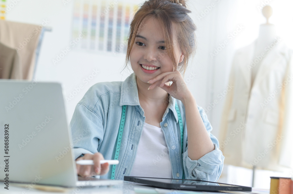 Young woman designer clothing, clothing designer workspace, clothing design accessories. Young woman designer clothing, clothing designer workspace, clothing design accessories.