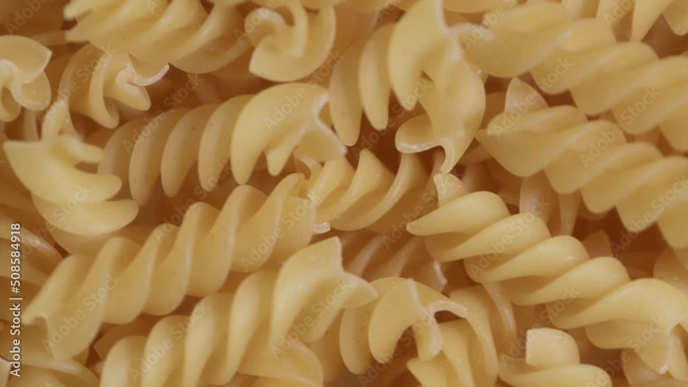 Close-up Fusilli Pasta on Turning Table - stock video Close-up Fusilli Pasta on Turning Table - stock video