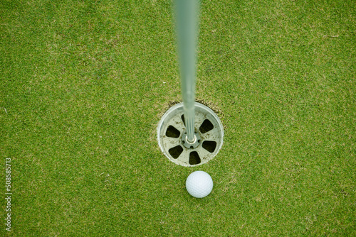 Wallpaper Mural Top view of a golf ball on green course at hole. Torontodigital.ca