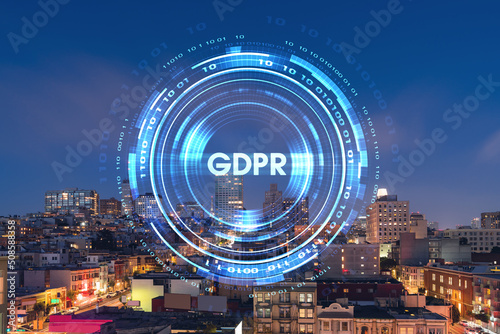 Roof top panoramic city view of San Francisco at night time, midtown skyline, California, United States. GDPR hologram, concept of data protection regulation and privacy for all individuals