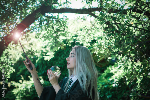 Halloween party and masquerade ideas, cosplay, people outfit. Witch from school of wizards and magic photo