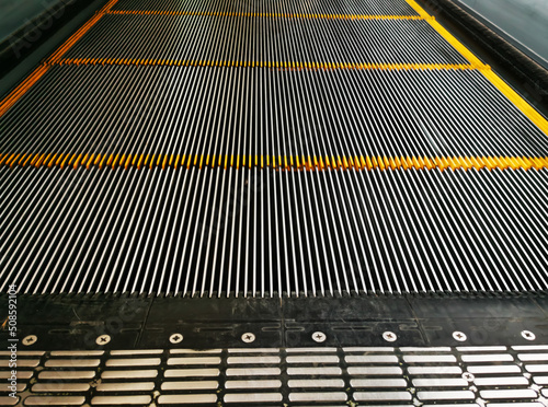 Escalator plate rails are moving.