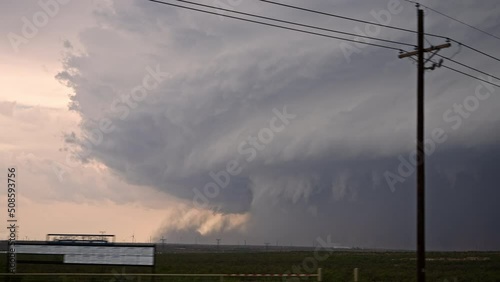 Driving towards supercell thunderstorm in Texas looking out the window from vehicle. photo