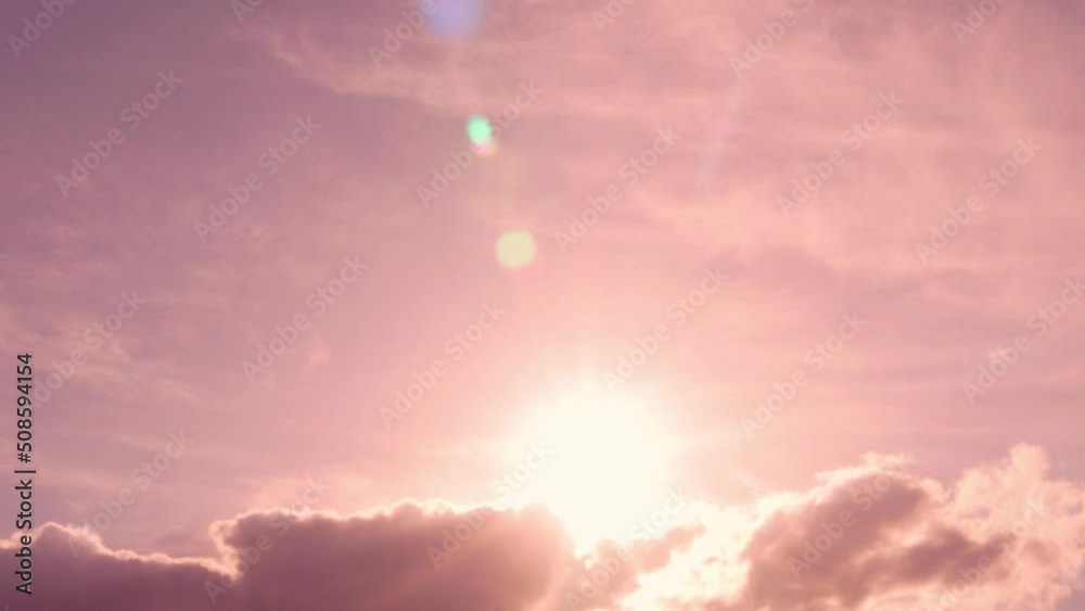 Sun Over Clouds Pink Lilac Dawn Sunrise, Time Lapse. Pink Sky Sunshine, Sun Glare, Sun Shines over Puffy Pink Cloud at Dawn. Summer Lilac Pink Dawn Sun and Clouds Beautiful Sunny Sky. Sun Over Clouds Pink Lilac Dawn Sunrise, Time Lapse. Pink Sky Sunshine, Sun Glare, Sun Shines over Puffy Pink Cloud at Dawn. Summer Lilac Pink Dawn Sun and Clouds Beautiful Sunny Sky.