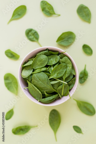 Fresh green baby spinach in bowl