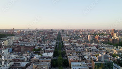 Harlem NYC drone shot with apartments, buildings, park space, cars