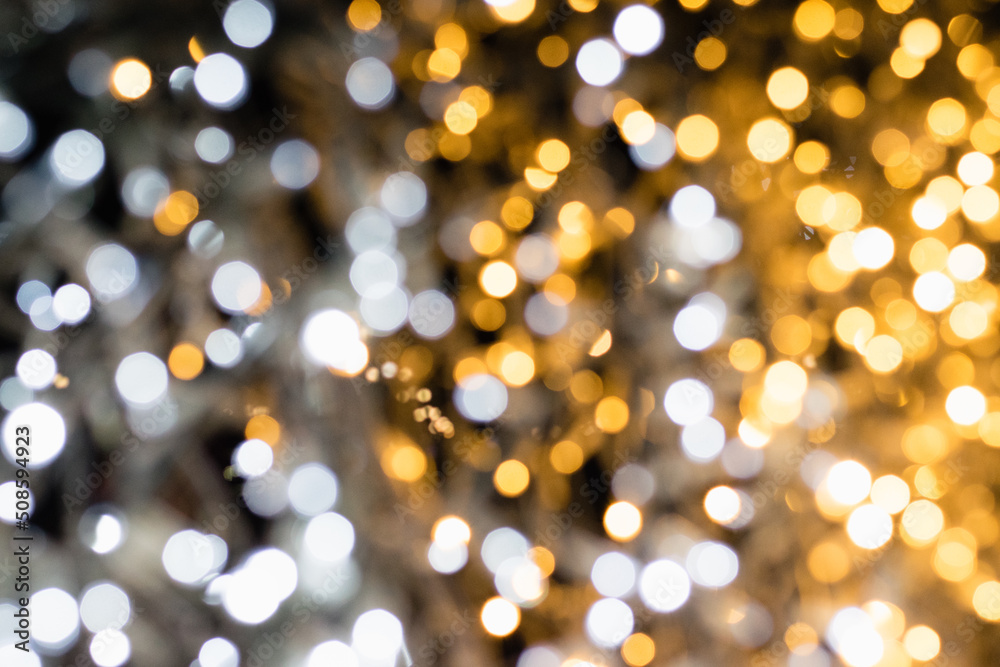 Christmas garland, festive background with white and yellow lights.