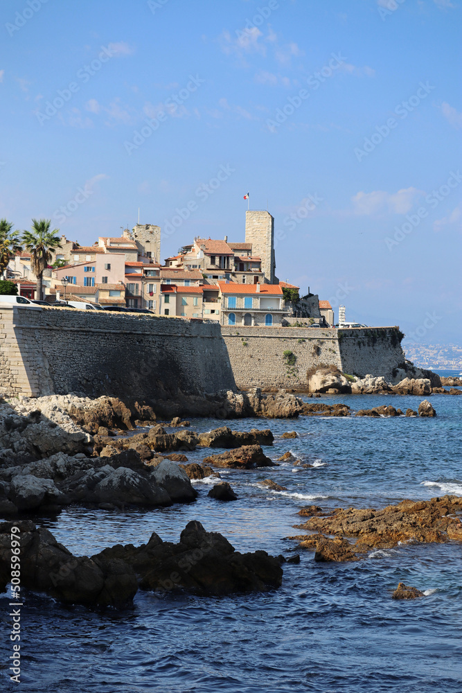 The famous view from the city beach to the fortress of Antibes