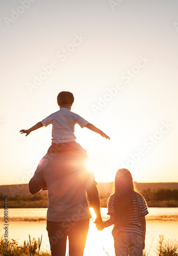 silhouette family at sunset background outdoors