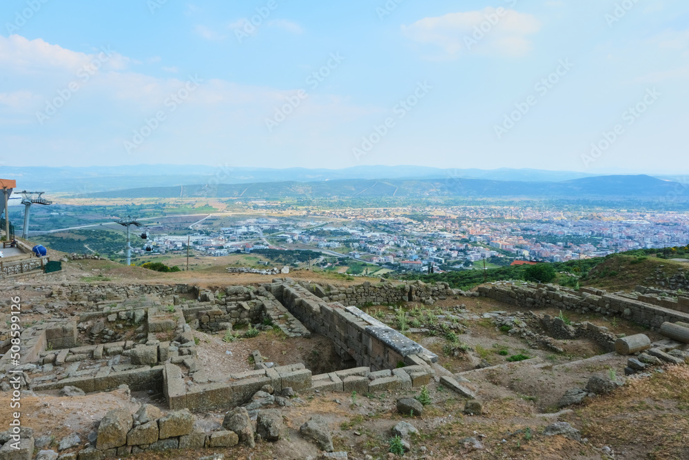 Acropolis of Pergamon Archeological City Ruins With Modern Bergama City Landscape For Compare. Selective Focus