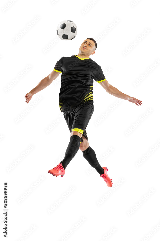 Dynamic portrait of professional male football soccer player training isolated on white studio background. Concept of sport, goals, competition, hobby, achievements Dynamic portrait of professional male football soccer player training isolated on white studio background. Concept of sport, goals, competition, hobby, achievements