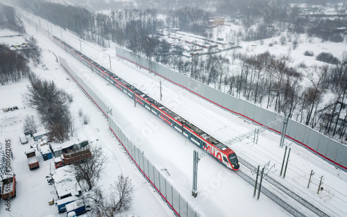 Train at snowy winter (aerial drone photo). Suburbs of Moscow, Russia