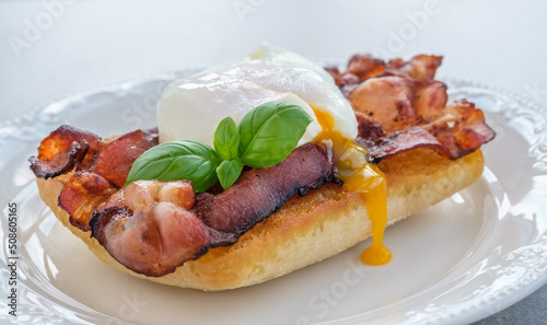 Sandwich with poached egg and bacon