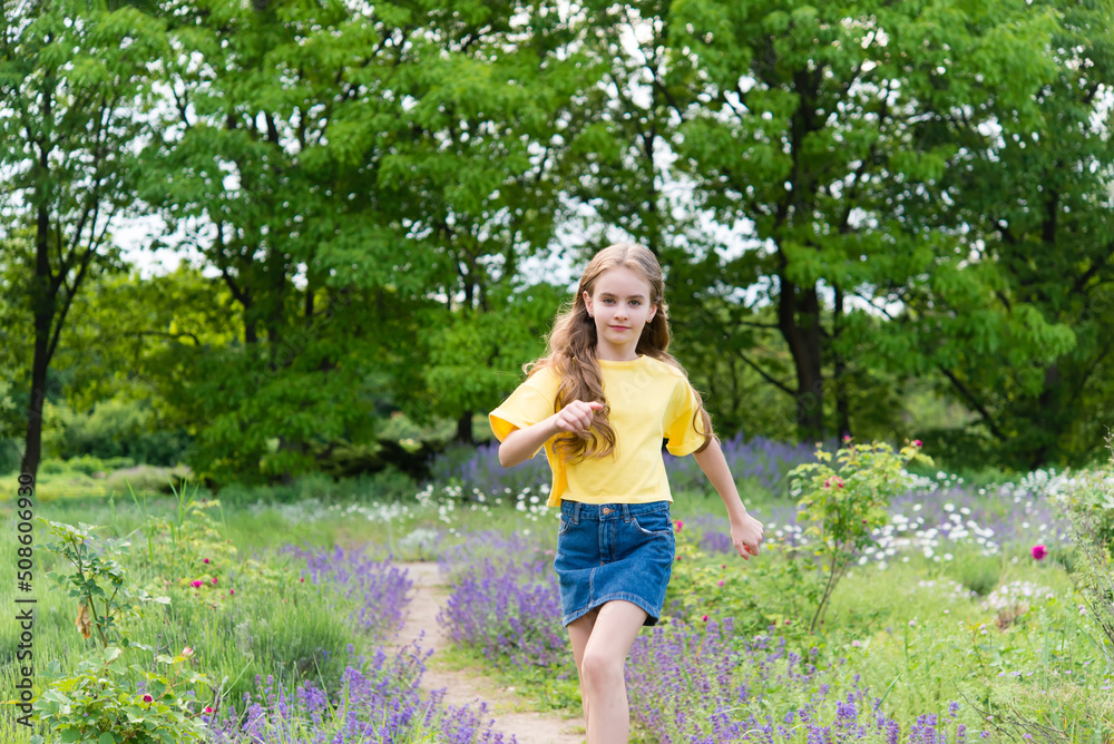 Funny happy little girl in summer outdoors, having fun having fun with cheerful smiling face. Funny happy little girl in summer outdoors, having fun having fun with cheerful smiling face.