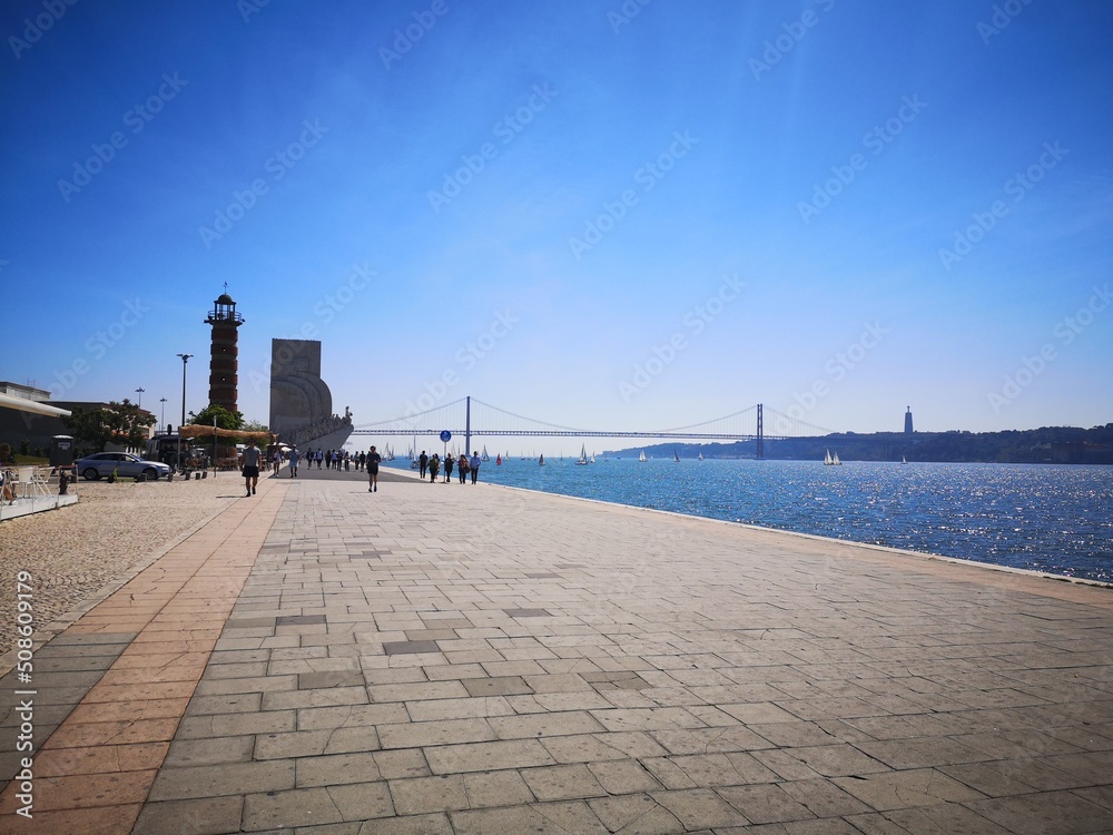 The 25th of April bridge, Cristo Rei, Museum of Discoveries, Lighthouse, and the Tagus River in Belem, Lisbon