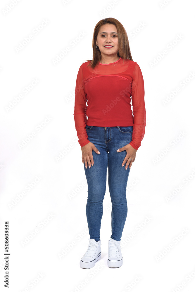 front view of a full portrait of a women with jeans and sneaker looking at camera over white background front view of a full portrait of a women with jeans and sneaker looking at camera over white background