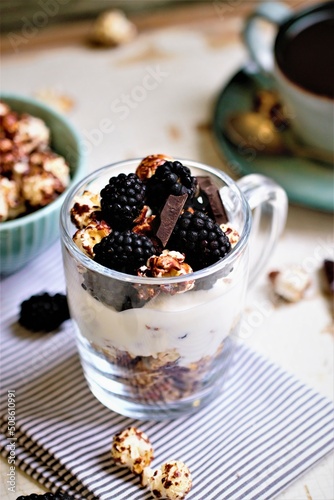 Granola and popcorn with berries and yogurt