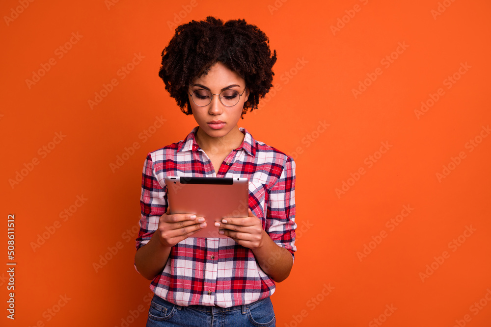 Photo of lady learning high school project using tablet gadget read post isolated shine color background Photo of lady learning high school project using tablet gadget read post isolated shine color background