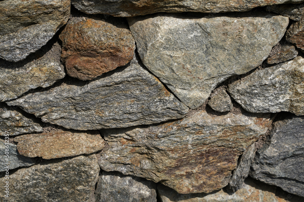Fototapeta premium Natural stone wall in a garden