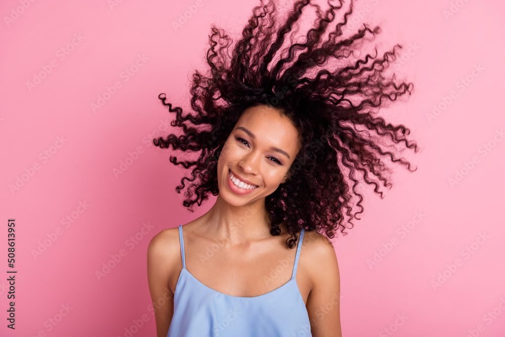 Portrait of positive adorable person toothy smile flying wavy hairdo isolated on pink color background Portrait of positive adorable person toothy smile flying wavy hairdo isolated on pink color background