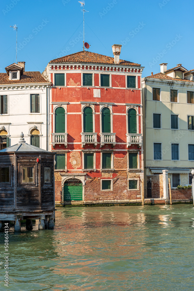Venice downtown. Old houses in the Venetian lagoon, Grand Canal (Canal Grande), UNESCO world heritage site, Veneto, Italy, Europe.